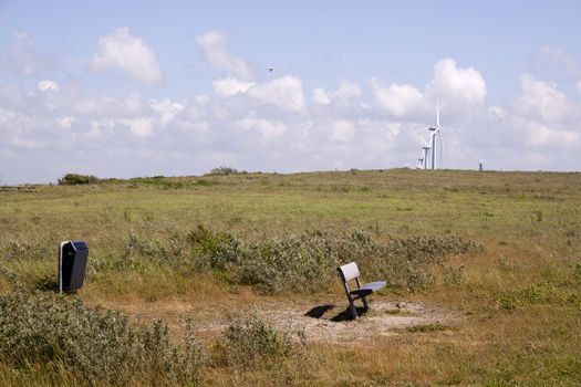 Lonely bench on the foot of a hill