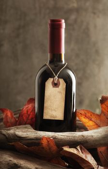 Red wine bottle with old paper label, copy space on label