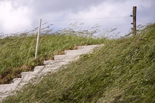 Stairs on a Dike along the coast of Holland