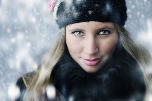Portrait of young woman in winter clothes 