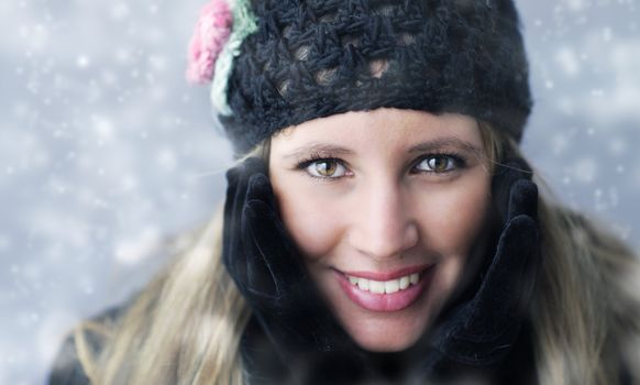 Portrait of young woman in winter clothes 