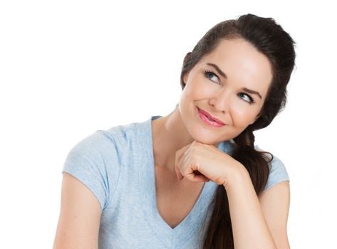 Close-up portrait of a happy beautiful woman looking thoughfully at copyspace. Isolated on white.