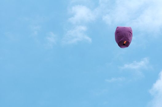 paper lantern with candle flying in the sky