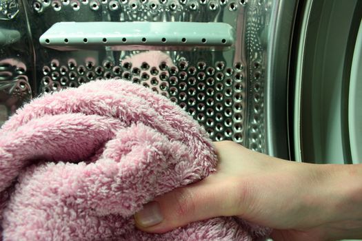 inside of washing machine hang holding towel