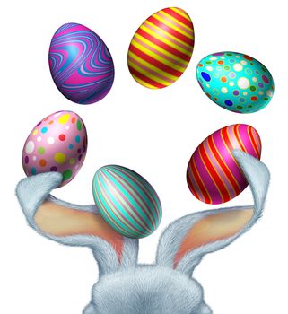 Easter bunny with white fur juggling decorated festive eggs using his big rabbit ears with a blank white area as a seasonal symbol of spring fun and celebration.