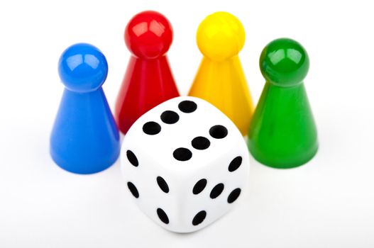 Board game Pieces and Dice over a plain white background.