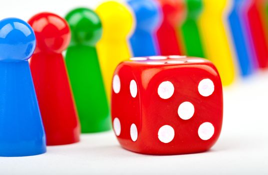 Board game Pieces and Dice over a plain white background.