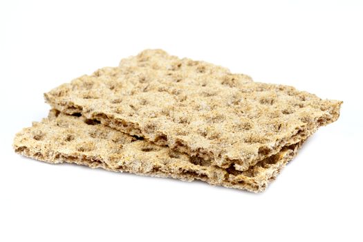 Two crispbread over a plain white background.