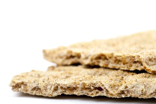 Close-up shot of crispbread over a white background.