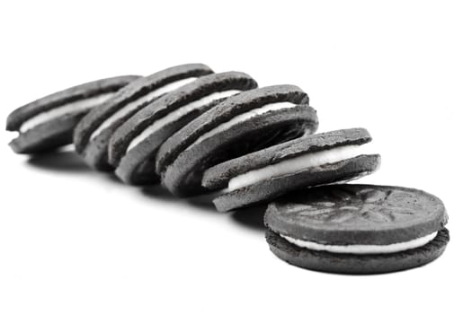 Oreo-style cookies over a white background.