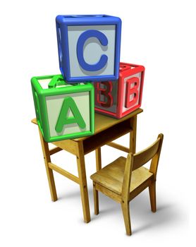 Primary education and early childhood learning with a school desk and basic letter blocks with a b and c representing childcare training of reading and writing skills.