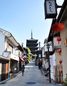 KYOTO, JAPAN - OCT 21 2012: Tourists walk on a street leading to Kiyomizu Temple on October 21 2012. Kiyomizu is a famous temple in Kyoto built in year 778.