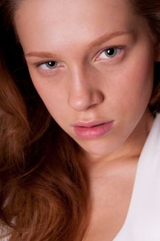 Young serious woman close-ip with focus on eyes