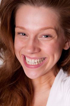 Laughing beauty caucasian teenager, close-up portrait with focus on eyes