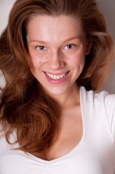 Laughing beauty caucasian teenager, close-up portrait with focus on eyes