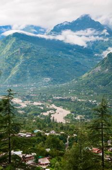 Valley with river between high mountains in clouds, North India,  Himalayan