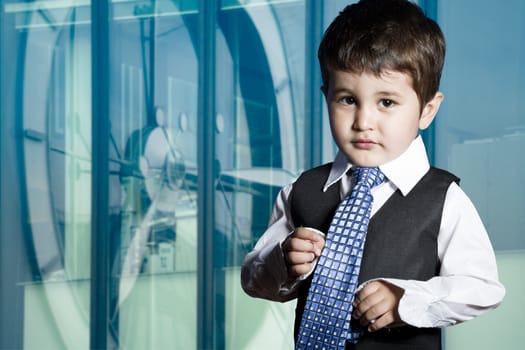 Child dressed businessman with funny face