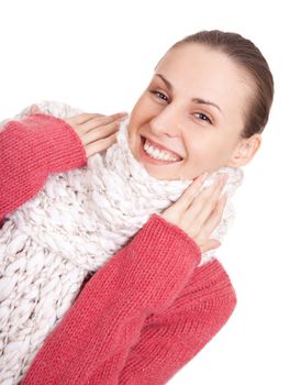 Beautiful young woman in red winter sweater and scarf on white background