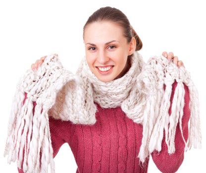 Beautiful young woman in red winter sweater and scarf on white background