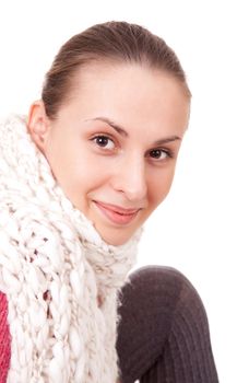 Beautiful young woman in winter scarf on white background