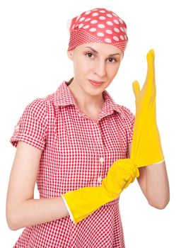 Young charlady dresses yellow gloves.  Isolated over white background
