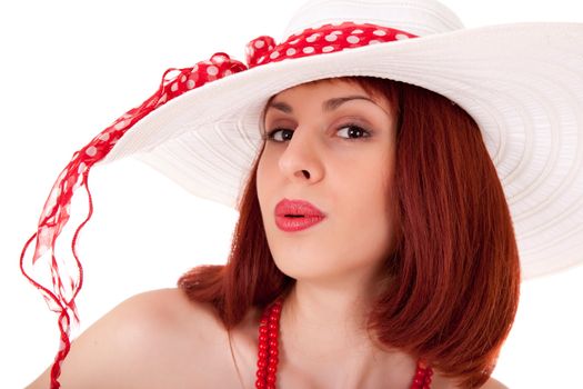 Fashion girl in retro style with bright make-up and big hat on white background