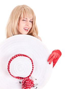 Playful fashion girl in retro style with bright make-up and big hat on white background