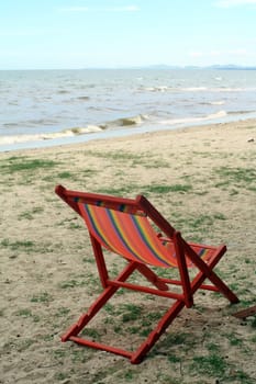 sun beach chairs on shore near sea