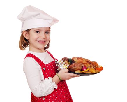 happy little girl cook hold roasted chicken