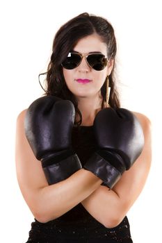 View of a beautiful girl in dark leather clothes against a white background with boxing gloves.