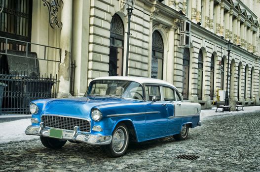 Blue classic vintage car in Bucharest old city, Romania