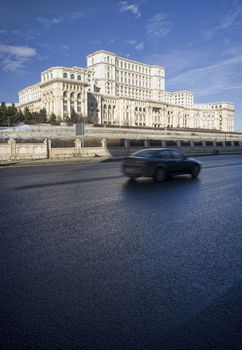 Palace of Parliament, Bucharest, Romania and moving car