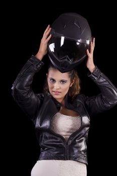 View of a beautiful young girl next to a white motorbike in a studio environment. 