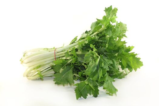 a bunch turnip greens on a white background