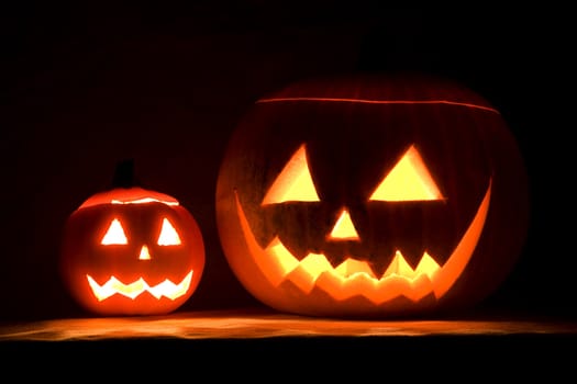 illuminated halloween pumpkins by night