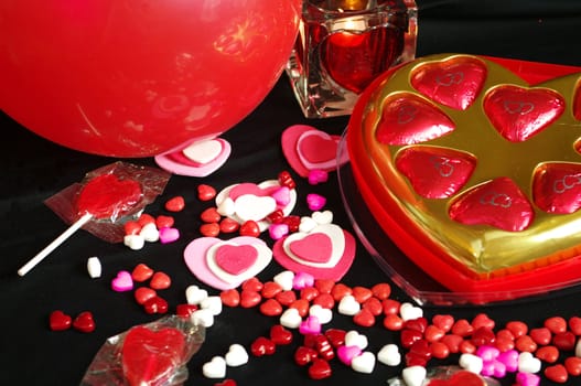 A Valentines Day Background with Candy Candle Hearts Balloon 