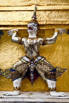 statue of mythical giant guardian in wat phra kaew, bangkok, thailand