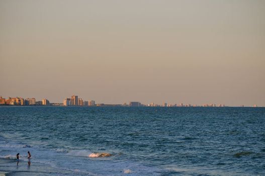 Couple talks in the waves on the Myrtle Beach Coastline