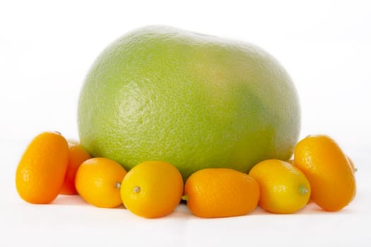 citrus - Sweetie and kumquats on a light background