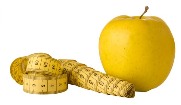 yellow apple and measuring tape on a white background