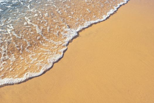 Soft wave of the sea on the sandy beach