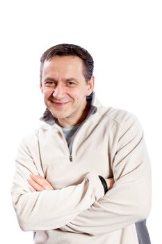 Casual man looking at camera with arms crossed on white background