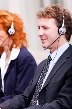 callcenter team business people with headphone at work in office