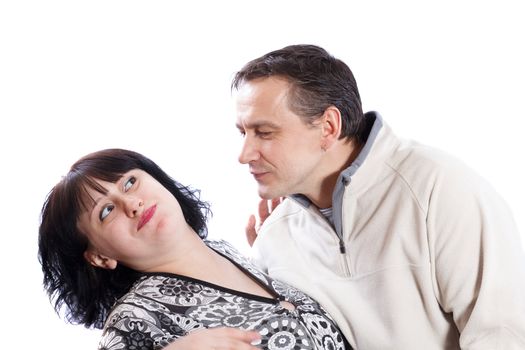 Man tries to kiss a woman on a white background