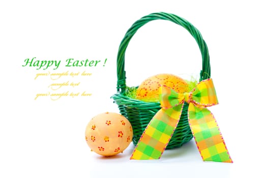 painted easter eggs in basket, isolated on white background.