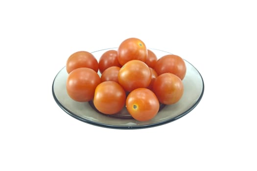 Tomatoes on a glass plate isolated on white background