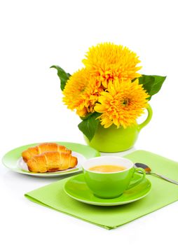 Fresh coffee and tasty croissant  and sunflowers, on the white background