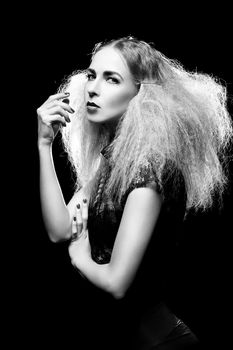 sexy blond woman with red lips and hairstyle on black background