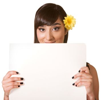 Cute woman behind blank poster on isolated background