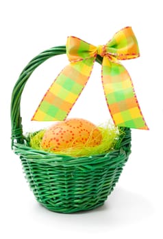 painted easter eggs in basket, isolated on white background.
